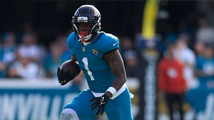Jacksonville Jaguars running back Travis Etienne Jr. (1) rushes for yards during the third quarter of an NFL football AFC Wild Card playoff matchup, Sunday, Jan. 11, 2026, in Jacksonville, Fla. The Bills defeated the Jaguars 27-24. [Corey Perrine/Florida Times-Union]