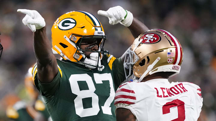 Green Bay Packers wide receiver Romeo Doubs (87) celebrates in front of San Francisco 49ers cornerback Deommodore Lenoir (2) after earning a first down during the second quarter at Lambeau Field. 