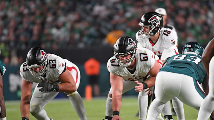 Sep 16, 2024; Philadelphia, Pennsylvania, USA; Atlanta Falcons guard Chris Lindstrom (63) and center Drew Dalman (67) lineup with quarterback Kirk Cousins (18) against the Philadelphia Eagles at Lincoln Financial Field. Mandatory Credit: Eric Hartline-Imagn Images