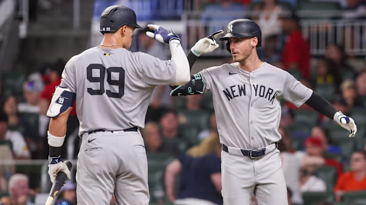 Jul 19, 2025; Atlanta, Georgia, USA; New York Yankees left fielder Cody Bellinger (35) celebrates with right fielder Aaron Judge (99) after a home run against the Atlanta Braves in the seventh inning at Truist Park. Mandatory Credit: Brett Davis-Imagn Images