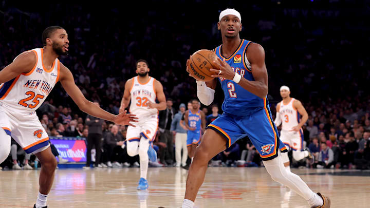 Jan 10, 2025; New York, New York, USA; Oklahoma City Thunder guard Shai Gilgeous-Alexander (2) looks to pass the ball against New York Knicks forward Mikal Bridges (25) during the first quarter at Madison Square Garden. Mandatory Credit: Brad Penner-Imagn Images