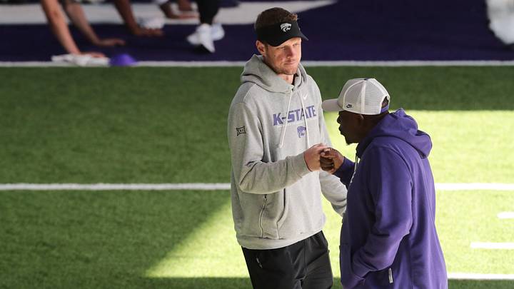 Kansas State head coach Collin Klein fist bumps associate head and wide receivers coach Thad Ward during practice on Tuesday, April 21, 2026. Kansas State head coach Collin Klein fist bumps associate head and wide receivers coach Thad Ward during practice on Tuesday, April 21, 2026.