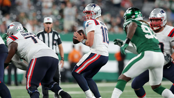 Sep 19, 2024; East Rutherford, New Jersey, USA; New England Patriots quarterback Drake Maye (10) looks to pass against the New York Jets during the fourth quarter at MetLife Stadium.