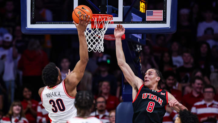 Feb 26, 2025; Tucson, Arizona, USA; Arizona Wildcats forward Tobe Awaka (30) shoots the ball while Utah Utes forward Keanu Dawes (8) fails to block him during the first half at McKale Center. Mandatory Credit: Aryanna Frank-Imagn Images