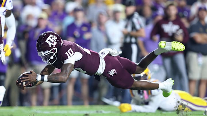 Oct 25, 2025; Baton Rouge, Louisiana, USA; Texas A&M Aggies quarterback Marcel Reed (10) runs for a touchdown during the first half against the Louisiana State Tigers at Tiger Stadium. Mandatory Credit: Stephen Lew-Imagn Images Oct 25, 2025; Baton Rouge, Louisiana, USA; Texas A&M Aggies quarterback Marcel Reed (10) runs for a touchdown during the first half against the Louisiana State Tigers at Tiger Stadium. Mandatory Credit: Stephen Lew-Imagn Images