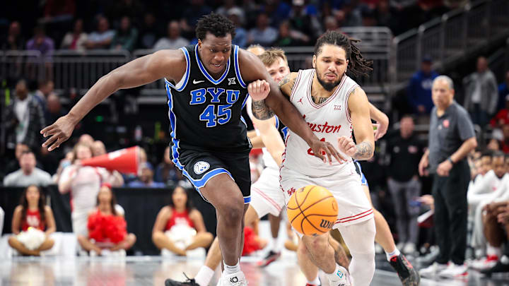Mar 14, 2025; Kansas City, MO, USA; Brigham Young Cougars center Fousseyni Traore (45) and Houston Cougars guard L.J. Cryer (4) go after a lose ball during the second half at T-Mobile Center. Mandatory Credit: William Purnell-Imagn Images