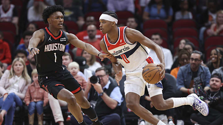 Mar 14, 2024; Houston, Texas, USA; Washington Wizards guard Bilal Coulibaly (0) dribbles the ball as Houston Rockets forward Amen Thompson (1) defends during the first quarter at Toyota Center. Mandatory Credit: Troy Taormina-Imagn Images