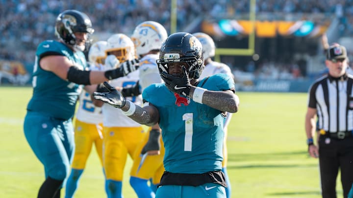 Jacksonville Jaguars running back Travis Etienne Jr. (1) celebrates his touchdown in the fourth quarter to make it 35-6 in an NFL football game at EverBank Stadium, Sunday, November 16, 2025, in Jacksonville, Fla. The Jaguars defeated the Chargers 35-6. [Doug Engle/Florida Times-Union]