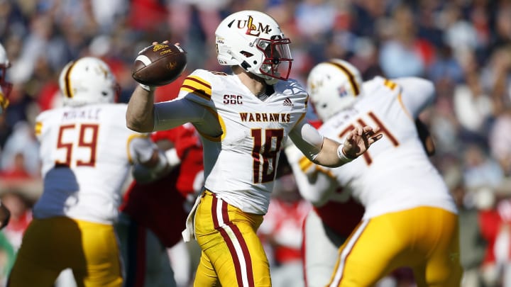 Nov 18, 2023; Oxford, Mississippi, USA; Louisiana Monroe Warhawks quarterback Jiya Wright (18) passes the ball against the Mississippi Rebels during the second half at Vaught-Hemingway Stadium. Mandatory Credit: Petre Thomas-USA TODAY Sports Nov 18, 2023; Oxford, Mississippi, USA; Louisiana Monroe Warhawks quarterback Jiya Wright (18) passes the ball against the Mississippi Rebels during the second half at Vaught-Hemingway Stadium. Mandatory Credit: Petre Thomas-USA TODAY Sports