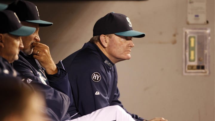 Seattle Mariners manager Eric Wedge (22) sits in the dugout during the ninth inning against the Oakland Athletics at Safeco Field in 2013.
