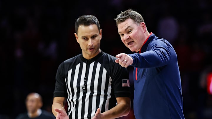 Jan 11, 2025; Tucson, Arizona, USA; Arizona Wildcats head coach Tommy Lloyd talks with the referee during the second half of the game against the UCF Knights at McKale Center. Mandatory Credit: Aryanna Frank-Imagn Images