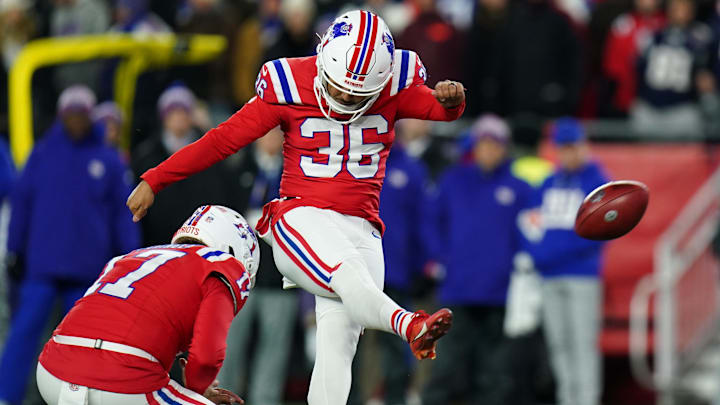 Dec 1, 2025; Foxborough, Massachusetts, USA; New England Patriots place kicker Andy Borregales (36) makes a kick out of the hold from New England Patriots punter Bryce Baringer (17) during the first quarter at Gillette Stadium. Mandatory Credit: David Butler II-Imagn Images