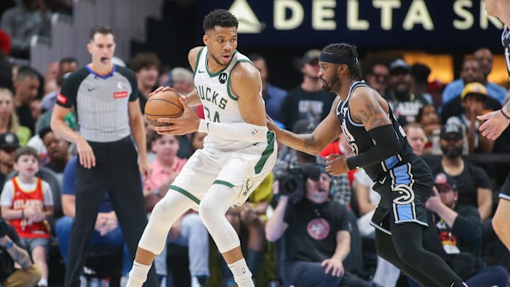Mar 30, 2024; Atlanta, Georgia, USA; Milwaukee Bucks forward Giannis Antetokounmpo (34) is defended Mar 30, 2024; Atlanta, Georgia, USA; Milwaukee Bucks forward Giannis Antetokounmpo (34) is defended