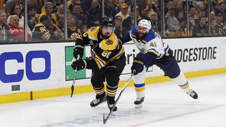 Jun 6, 2019; Boston, MA, USA; Boston Bruins left wing Marcus Johansson (90) chases the puck with St. Louis Blues defenseman Robert Bortuzzo (41) during the third period in game five of the 2019 Stanley Cup Final at TD Garden. Mandatory Credit: Winslow Townson-Imagn Images