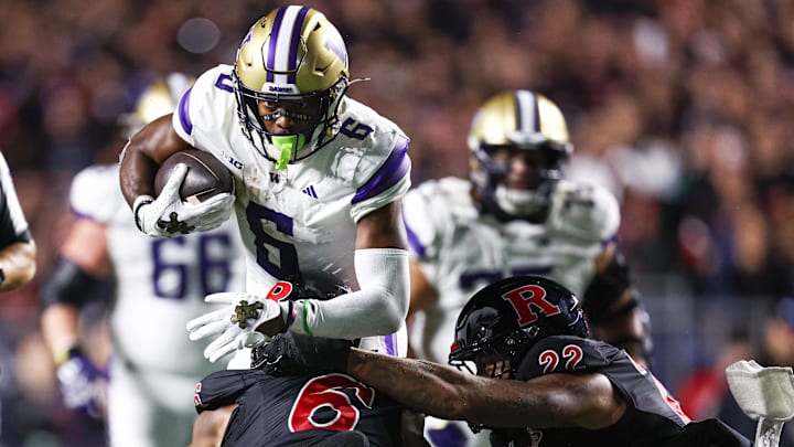 UW receiver Jeremiah Hunter gets tackled by Rutgers defensive back Shaquan Loyal (6) and linebacker Tyreem Powell. UW receiver Jeremiah Hunter gets tackled by Rutgers defensive back Shaquan Loyal (6) and linebacker Tyreem Powell.