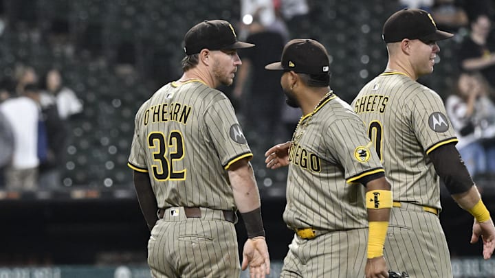 Sep 20, 2025; Chicago, Illinois, USA;  San Diego Padres first baseman Ryan O'Hearn (32) and  first baseman Luis Arraez (4) high five after the game against the Chicago White Sox at Rate Field. 