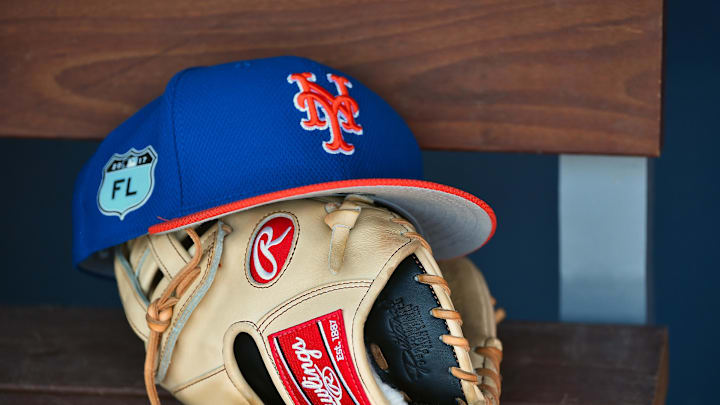 Mar 16, 2017; West Palm Beach, FL, USA; A view of a New York Mets hat and glove in the dugout during a spring training game against the Washington Nationals at The Ballpark of the Palm Beaches. Mandatory Credit: Jasen Vinlove-Imagn Images