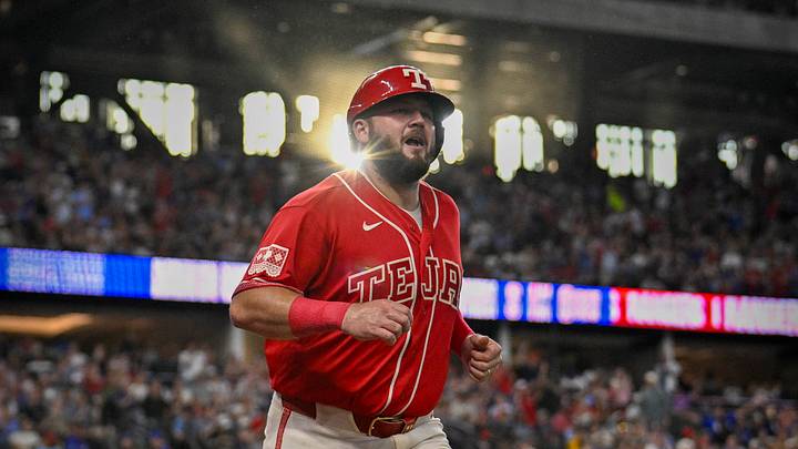 Jun 19, 2026; Arlington, Texas, USA; Texas Rangers first baseman Jake Burger (21) comes off the field after he scores a run against the San Diego Padres during the first inning at Globe Life Field. Mandatory Credit: Jerome Miron-Imagn Images