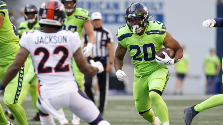 Sep 12, 2022; Seattle, Washington, USA; Seattle Seahawks running back Rashaad Penny (20) rushes against the Denver Broncos during the first quarter at Lumen Field. Mandatory Credit: Joe Nicholson-USA TODAY Sports Sep 12, 2022; Seattle, Washington, USA; Seattle Seahawks running back Rashaad Penny (20) rushes against the Denver Broncos during the first quarter at Lumen Field. Mandatory Credit: Joe Nicholson-USA TODAY Sports
