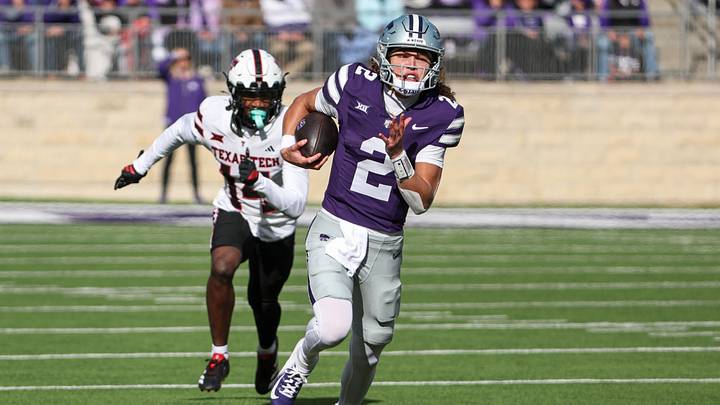 Nov 1, 2025; Manhattan, Kansas, USA; Kansas State Wildcats quarterback Avery Johnson (2) runs with the ball for a touchdown against Texas Tech Red Raiders defensive back Brice Pollock (14) in the first quarter at Bill Snyder Family Football Stadium. Mandatory Credit: Scott Sewell-Imagn Images Nov 1, 2025; Manhattan, Kansas, USA; Kansas State Wildcats quarterback Avery Johnson (2) runs with the ball for a touchdown against Texas Tech Red Raiders defensive back Brice Pollock (14) in the first quarter at Bill Snyder Family Football Stadium. Mandatory Credit: Scott Sewell-Imagn Images