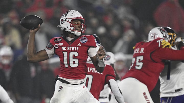 Dec 28, 2024; Annapolis, MD, USA;  North Carolina State Wolfpack quarterback CJ Bailey (16) throws from the pocket during the first half of the the Go Bowling Military Bowl against the East Carolina Pirates at Navy-Marine Corps Memorial Stadium. Mandatory Credit: Tommy Gilligan-Imagn Images