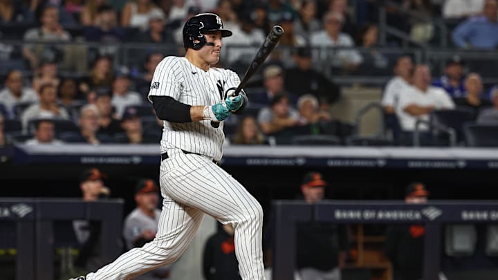 Sep 26, 2024; Bronx, New York, USA; New York Yankees first baseman Anthony Rizzo (48) hits a two RBI single during the sixth inning against the Baltimore Orioles at Yankee Stadium. Mandatory Credit: Vincent Carchietta-Imagn Images
