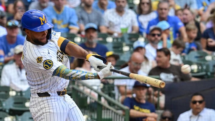 Jul 27, 2025; Milwaukee, Wisconsin, USA; Milwaukee Brewers center fielder Jackson Chourio (11) hits a double to drive in a run in the third inning against the Miami Marlins at American Family Field. Mandatory Credit: Benny Sieu-Imagn Images