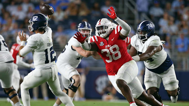 Sep 21, 2024; Oxford, Mississippi, USA; Mississippi Rebels defensive linemen JJ Pegues (38) gets by Georgia Southern Eagles offensive linemen Pichon Wimbley (74) as he rushes Georgia Southern Eagles quarterback JC French (12) during the first half at Vaught-Hemingway Stadium. Mandatory Credit: Petre Thomas-Imagn Images