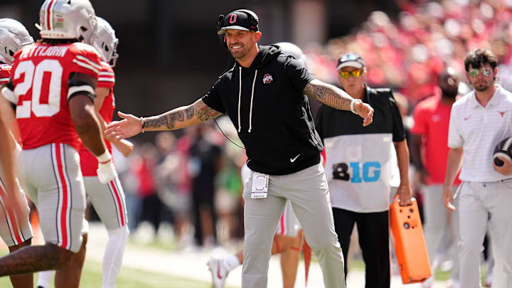Ohio State Buckeyes linebackers coach James Laurinaitis celebrates with players during the NCAA football game against the Texas Longhorns at Ohio Stadium on Aug. 30, 2025.