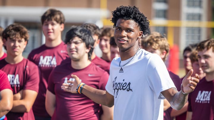 Former MBA quarterback and current Texas A&M starter Marcel Reed speaks at the start of a kids’ football camp held at MBA Saturday, July 12, 2025.