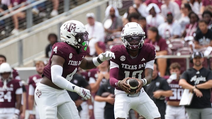 Sep 6, 2025; College Station, Texas, USA; Texas A&M Aggies quarterback Marcel Reed (10) and Texas A&M Aggies running back Rueben Owens II (4) during the first quarter against the Utah State Aggies at Kyle Field. Mandatory Credit: Sean Thomas-Imagn Images