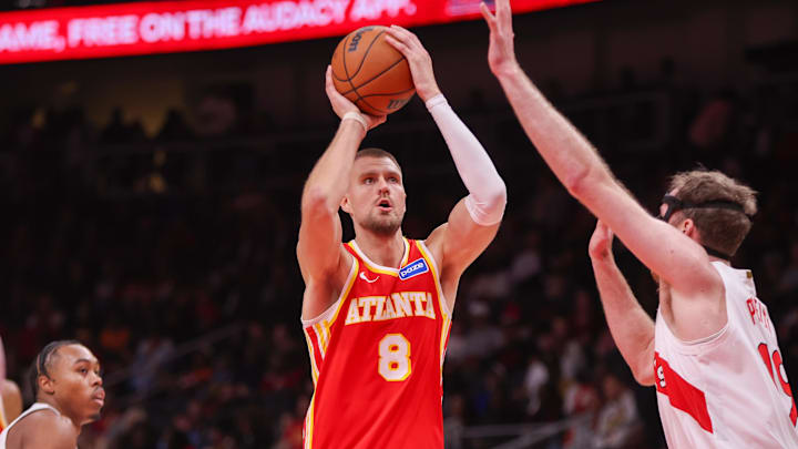 Oct 22, 2025; Atlanta, Georgia, USA; Atlanta Hawks center Kristaps Porzingis (8) shoots against the Toronto Raptors in the second quarter at State Farm Arena. Mandatory Credit: Brett Davis-Imagn Images
