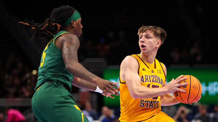 Mar 10, 2026; Kansas City, MO, USA; Arizona State Sun Devils guard Noah Meeusen (15) drives around Baylor Bears guard Obi Agbim (5) during the first half at T-Mobile Center. Mandatory Credit: William Purnell-Imagn Images