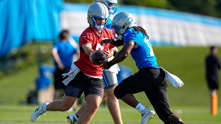 Detroit Lions quarterback Luke Altmyer (2) hands the ball to running back Isiah Pacheco (10) at practice during training camp at Meijer Performance Center in Allen Park on Thursday, July 30, 2026.