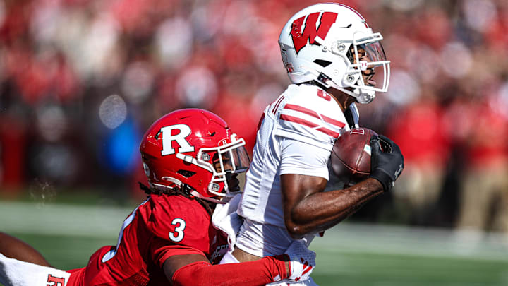 Oct 12, 2024; Piscataway, New Jersey, USA; Wisconsin Badgers wide receiver Vinny Anthony II (8) catches the ball as Rutgers Scarlet Knights defensive back Bo Mascoe (3) tackles during the second half at SHI Stadium.