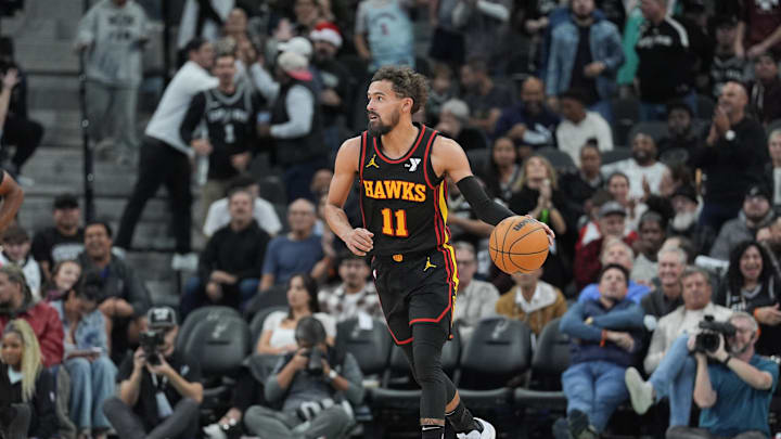 Dec 19, 2024; San Antonio, Texas, USA; Atlanta Hawks guard Trae Young (11) dribbles the ball in overtime against the San Antonio Spurs at Frost Bank Center. Mandatory Credit: Daniel Dunn-Imagn Images Dec 19, 2024; San Antonio, Texas, USA; Atlanta Hawks guard Trae Young (11) dribbles the ball in overtime against the San Antonio Spurs at Frost Bank Center. Mandatory Credit: Daniel Dunn-Imagn Images