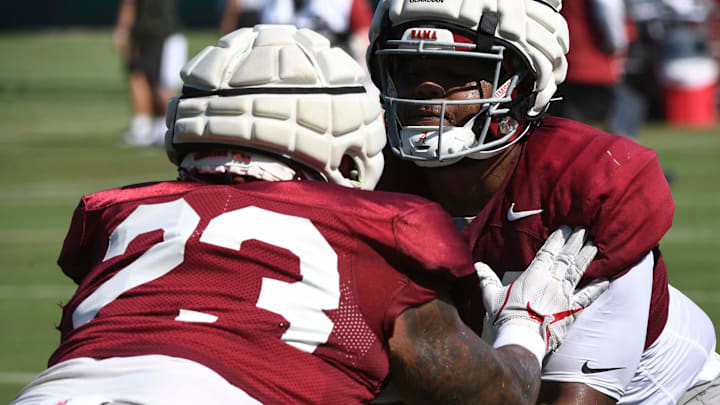 The Alabama Crimson Tide football team works out Sunday morning in practice as they prepare for the 2024 season. Alabama defensive lineman James Smith (23) and Alabama defensive lineman Damon Payne Jr. (44) work against each other. The Alabama Crimson Tide football team works out Sunday morning in practice as they prepare for the 2024 season. Alabama defensive lineman James Smith (23) and Alabama defensive lineman Damon Payne Jr. (44) work against each other.