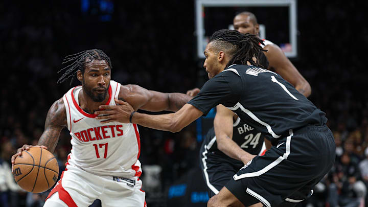 Jan 1, 2026; Brooklyn, New York, USA; Houston Rockets forward Tari Eason (17) dribbles as Brooklyn Nets forward Ziaire Williams (1) defends during the second half at Barclays Center. Mandatory Credit: Vincent Carchietta-Imagn Images