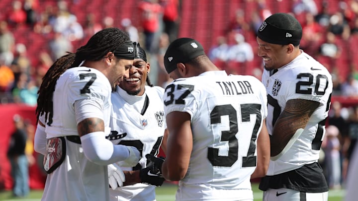 Dec 8, 2024; Tampa, Florida, USA; Las Vegas Raiders safety Tre'von Moehrig (7), safety Thomas Harper (34), safety Trey Taylor (37) and safety Isaiah Pola-Mao (20) prior to the game against the Tampa Bay Buccaneers at Raymond James Stadium. Mandatory Credit: Kim Klement Neitzel-Imagn Images