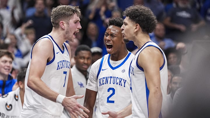 Nov 12, 2024; Atlanta, Georgia, USA; Kentucky Wildcats forward Andrew Carr (7) reacts with teammates after a basket against the Duke Blue Devils during the second half at State Farm Arena. Mandatory Credit: Dale Zanine-Imagn Images
