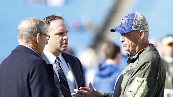 Buffalo Bills head coach Rex Ryan (right) talks with Miami Dolphins owner Stephen M. Ross (left) and Mike Tannenbaum the Dolphins executive vice president of football operations before the game at Ralph Wilson Stadium in 2015.