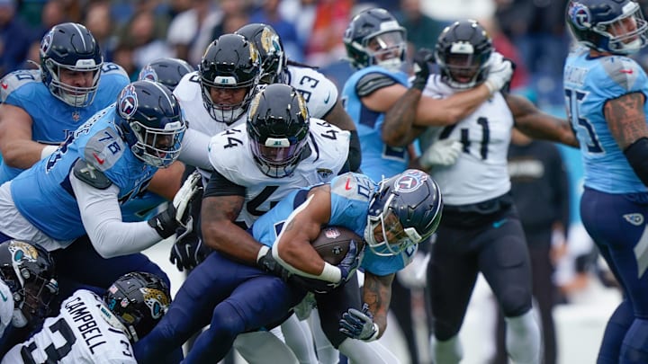 Tennessee Titans running back Tony Pollard (20) gets a first down during the first quarter at Nissan Stadium in Nashville, Tenn., Sunday, Dec. 8, 2024.
