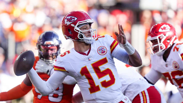 Nov 16, 2025; Denver, Colorado, USA;  Kansas City Chiefs quarterback Patrick Mahomes (15) throws a pass during the first quarter of the game against the Denver Broncos at Empower Field at Mile High. Mandatory Credit: Ron Chenoy-Imagn Images