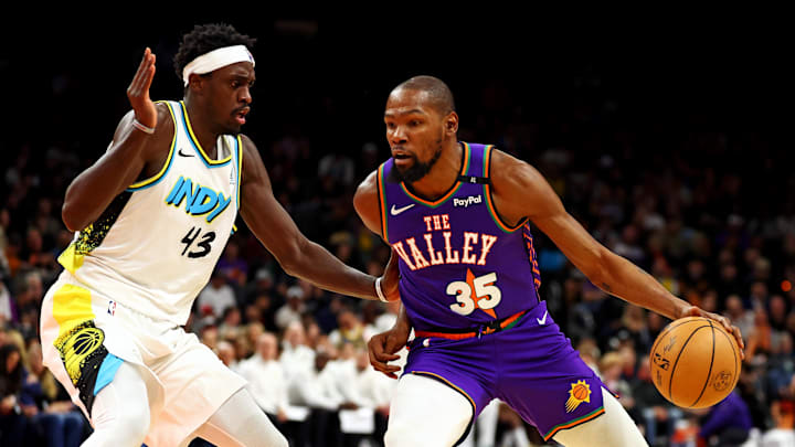 Dec 19, 2024; Phoenix, Arizona, USA; Phoenix Suns forward Kevin Durant (35) drives to the basket against Indiana Pacers forward Pascal Siakam (43) during the third quarter at Footprint Center. Mandatory Credit: Mark J. Rebilas-Imagn Images