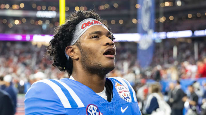 Jan 8, 2026; Glendale, AZ, USA; Mississippi Rebels quarterback Austin Simmons (13) against the Miami Hurricanes during the 2026 Fiesta Bowl and semifinal game of the College Football Playoff at State Farm Stadium. Mandatory Credit: Mark J. Rebilas-Imagn Images