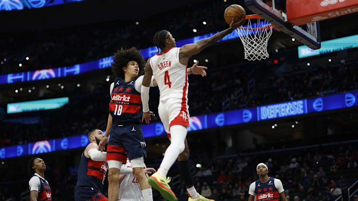Jan 7, 2025; Washington, District of Columbia, USA; Houston Rockets guard Jalen Green (4) shoots the ball as Washington Wizards forward Kyshawn George (18) defends in the third quarter at Capital One Arena. Mandatory Credit: Geoff Burke-Imagn Images