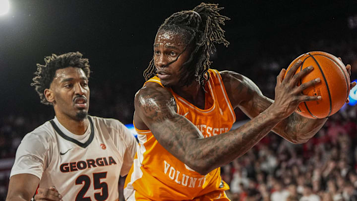 Jan 28, 2026; Athens, Georgia, USA; Tennessee Volunteers center Felix Okpara (34) controls the ball behind Georgia Bulldogs forward Justin Abson (25) during the first half at Stegeman Coliseum. Mandatory Credit: Dale Zanine-Imagn Images
