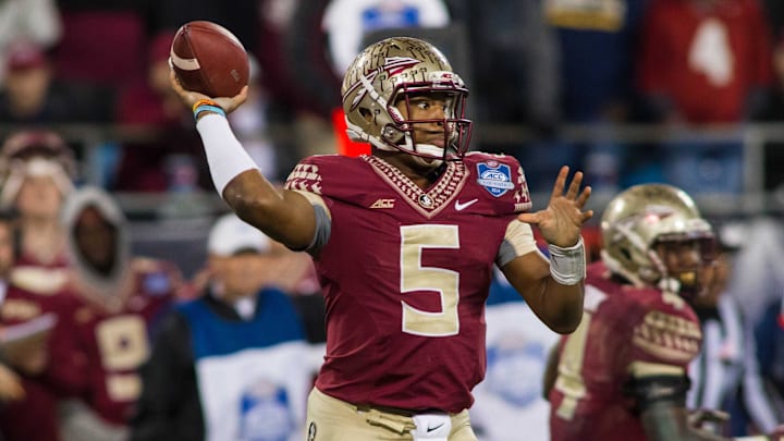 Dec 6, 2014; Charlotte, NC, USA; Florida State Seminoles quarterback Jameis Winston (5) passes the ball during the third quarter against the Georgia Tech Yellow Jackets at Bank of America Stadium. FSU defeated Georgia Tech 37-35. Mandatory Credit: Jeremy Brevard-Imagn Images