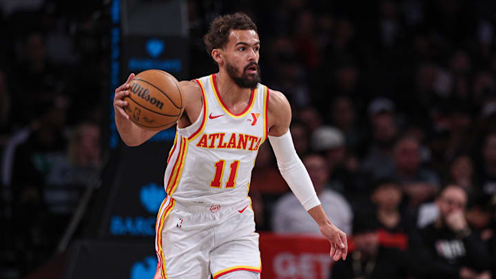 Mar 16, 2025; Brooklyn, New York, USA; Atlanta Hawks guard Trae Young (11) dribbles up court during the first quarter against the Brooklyn Nets at Barclays Center. Mandatory Credit: Vincent Carchietta-Imagn Images Mar 16, 2025; Brooklyn, New York, USA; Atlanta Hawks guard Trae Young (11) dribbles up court during the first quarter against the Brooklyn Nets at Barclays Center. Mandatory Credit: Vincent Carchietta-Imagn Images