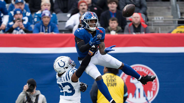 New York Giants wide receiver Malik Nabers (1) catches a pass in the air while being guarded by Indianapolis Colts defensive back Kenny Moore II (23) during a game between New York Giants and Indianapolis Colts at MetLife Stadium on Sunday, Dec. 29, 2024.